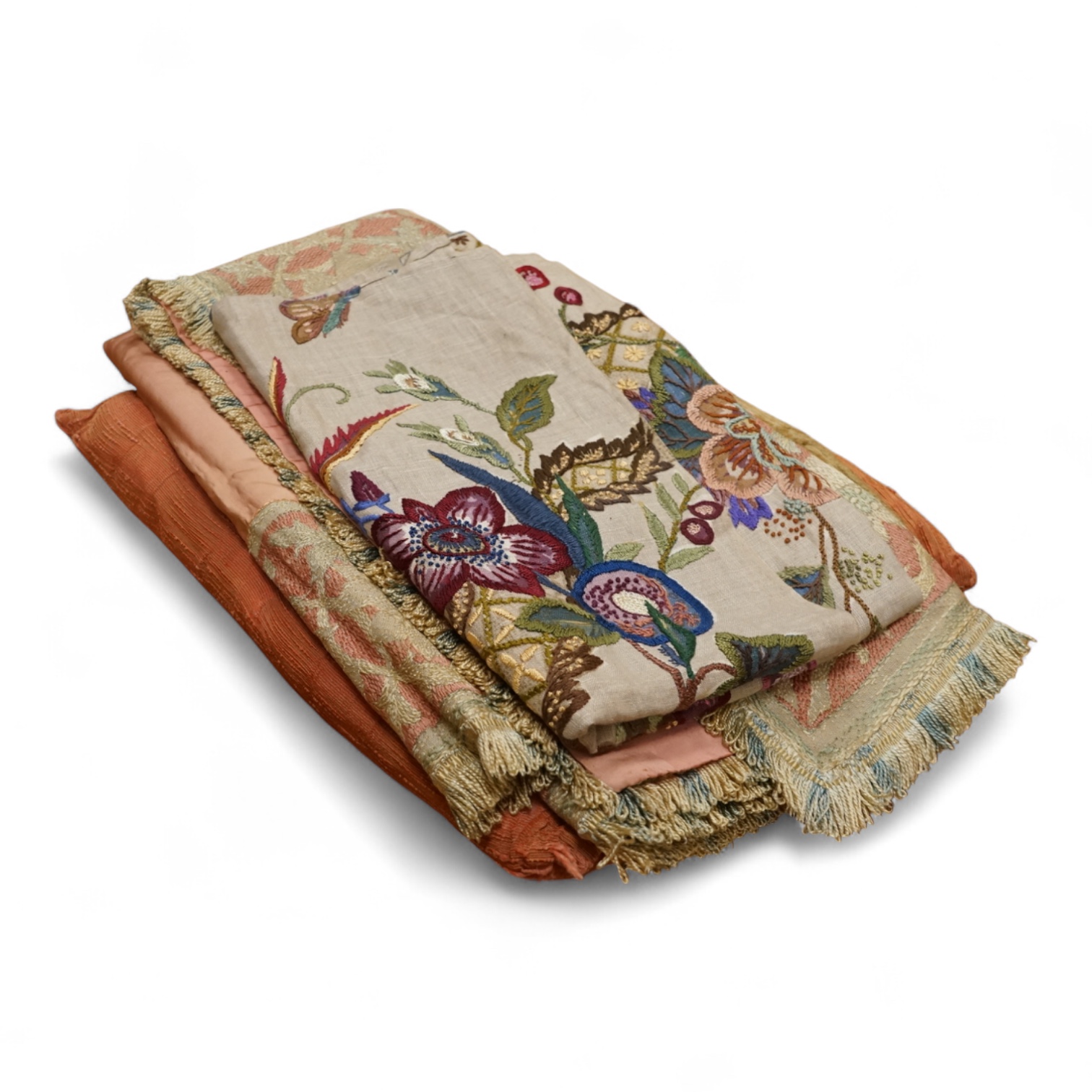 An Arts and Crafts embroidered table cover, an embroidered printed fabric sample later embroidered and a bird embroidered cushion.